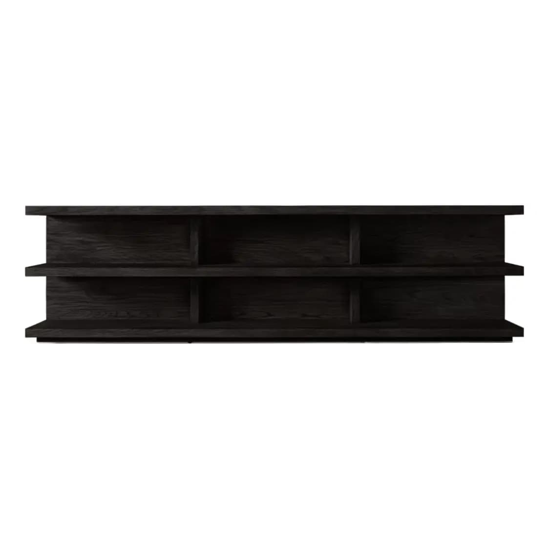 A low, long, dark-colored bookshelf with an open design. It features two horizontal shelves, each divided by vertical supports into three sections, creating a total of six open compartments. The unit has a substantial base and appears to be made of wood with a visible grain texture. — 3D model