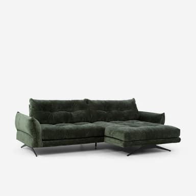 A modern sectional sofa upholstered in a textured dark green fabric. The sofa features deep tufting on the back cushions and seat cushions, creating a grid pattern. It has a chaise lounge on the right side and is supported by slender black metal legs with a distinctive angled design on the left, and a single sculptural metal base on the right. The armrests are wide and rounded. — 3D model