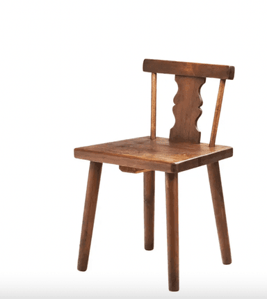 A rustic wooden chair with four tapered legs, a flat seat, and a backrest. The backrest features a decorative carved element with three scalloped curves in the center, supported by two vertical posts. The overall construction suggests a handmade or artisanal origin. — 3D model