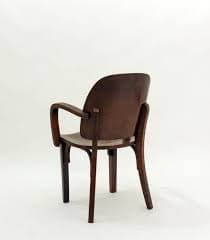 A wooden armchair with a curved backrest and armrests. The chair has a simple, yet elegant design, featuring bentwood elements. The seat is flat and appears to be made of the same wood as the frame. The legs are straight and provide a stable base. — 3D model