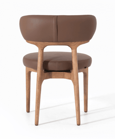 A contemporary chair with a wooden frame and upholstered seat and backrest. The frame has a natural wood finish with visible grain. The seat and backrest are upholstered in brown leather, featuring a smooth texture and rounded edges. — 3D model