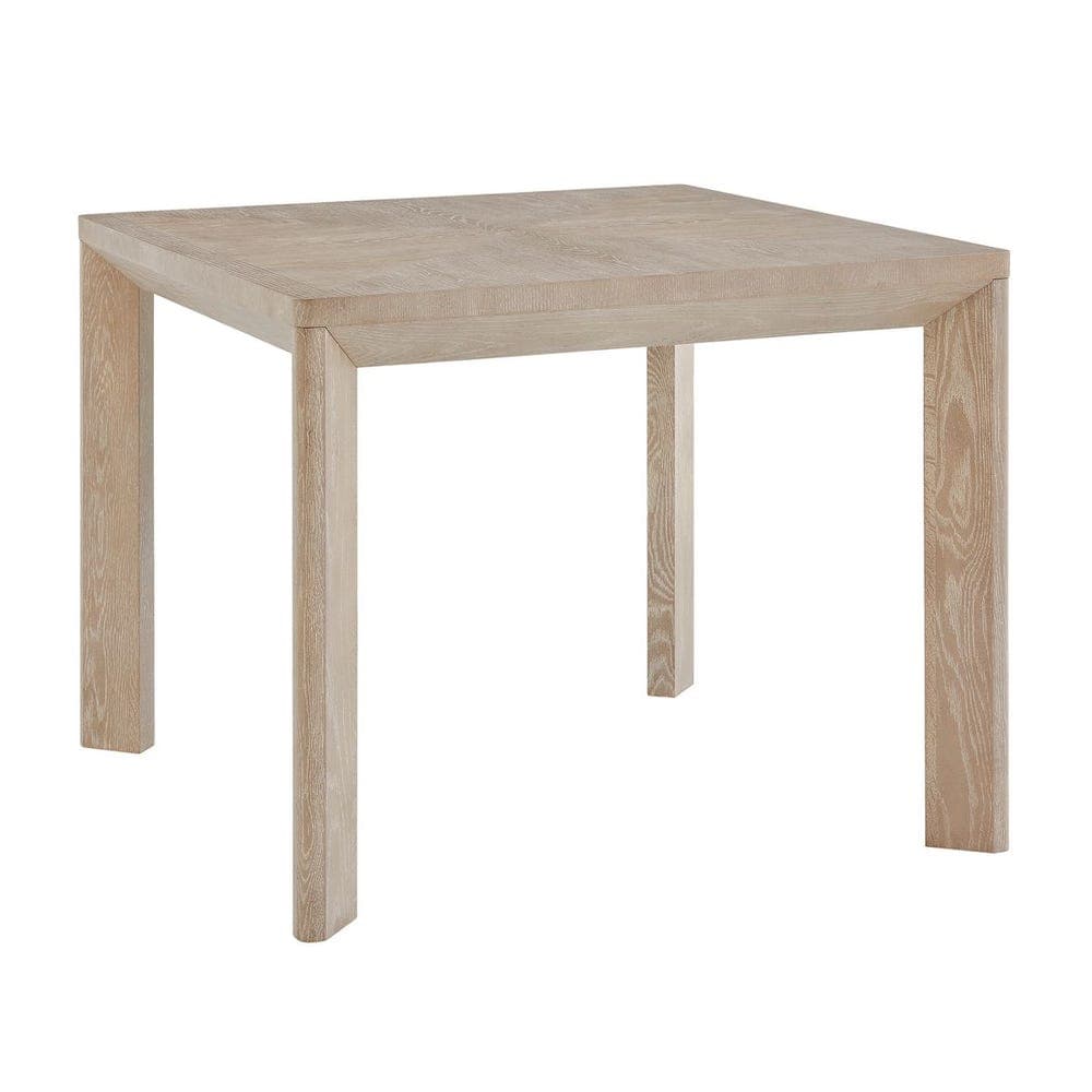 A minimalist square dining table constructed from wood with a light, washed oak finish. It features a thick, solid tabletop supported by four sturdy, square-profile block legs. The design emphasizes clean lines and a simple, contemporary aesthetic, allowing the natural grain of the wood to be a prominent visual feature despite the light finish. — 3D model