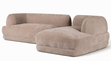 A two-piece modular sectional sofa featuring a rounded backrest and armrests, upholstered in a soft, light beige fabric. The configuration includes a main sofa unit and an attached chaise lounge. — 3D model