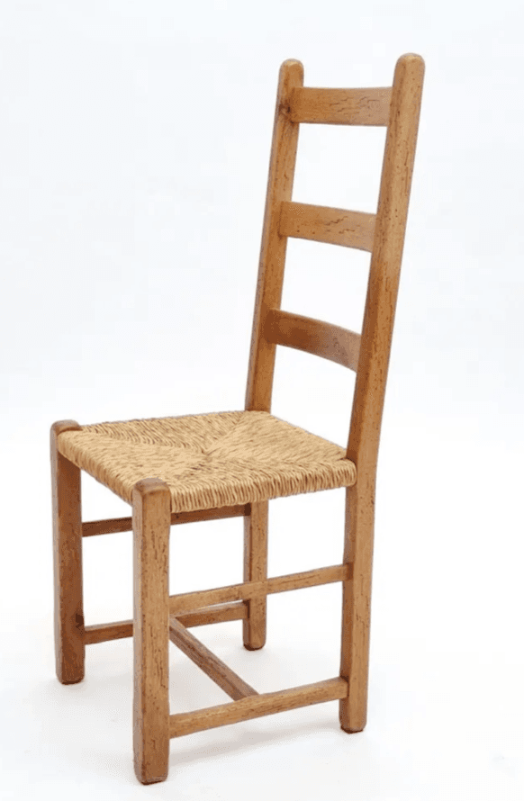 A traditional-style wooden dining chair featuring a ladder-back design and a woven rush seat, presented with a natural wood finish. — 3D model