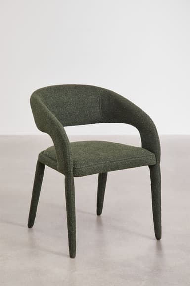 An upholstered armchair with a continuous curved back and integrated armrests, all covered in a textured dark green fabric, standing on four tapered legs. — 3D model