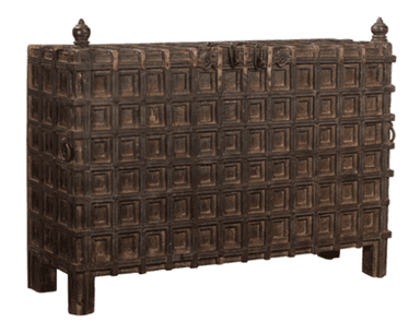 A dark brown, heavily textured wooden storage chest, rectangular in form, featuring a distinct grid-like paneling pattern across all visible surfaces. It is supported by short, sturdy block feet and includes decorative finials at the top corners and metal ring pull handles on the sides. A central latch mechanism is visible on the front edge of the lid. — 3D model