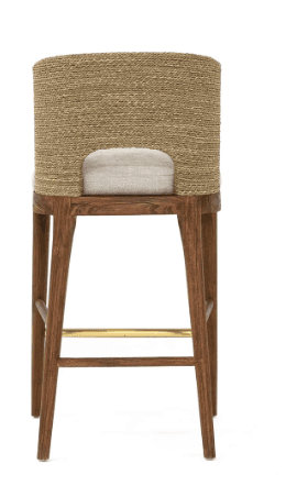 A high-backed bar stool with a solid wood frame, an upholstered seat in a light fabric, and a curved backrest made of tightly woven natural fibers. It features a brass footrest bar. — 3D model