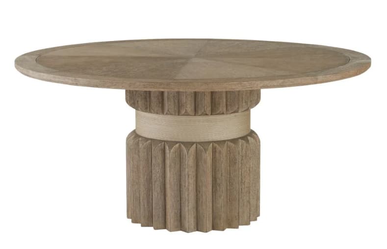 A contemporary round dining table crafted from light-toned wood, featuring a substantial fluted pedestal base. The tabletop presents a radial wood grain pattern, while the cylindrical base includes a lower section with pronounced vertical fluting and an upper, slightly narrower band with a subtle woven or textured finish, all in a cohesive natural wood hue. — 3D model