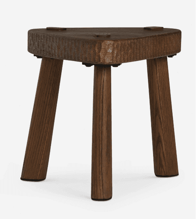 A triangular wooden stool with three splayed legs, featuring a hand-carved or rough-hewn texture on the edges of the seat. The wood has a dark brown finish. — 3D model