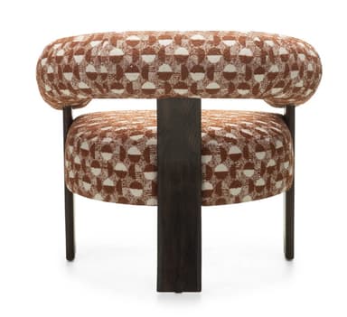 A contemporary armchair featuring a curved, padded backrest that extends into armrests. The seat is also padded and supported by four dark wooden legs. The upholstery displays a geometric pattern in brown and white. — 3D model