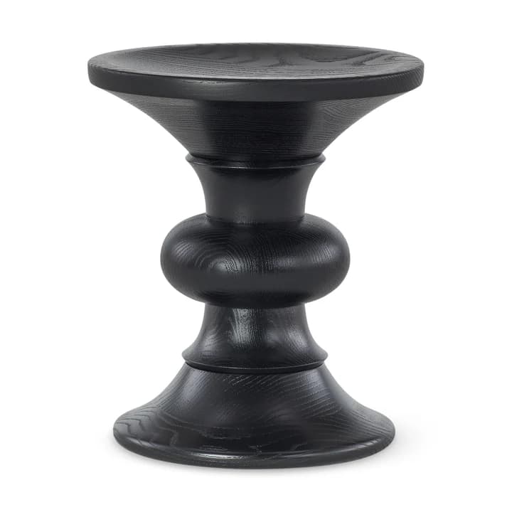 A dark-colored wooden stool with a unique, sculptural design. The stool features a circular top that flares outwards, supported by a central spindle-like structure. This central section has a bulbous, rounded form in the middle, transitioning to more flared sections towards the top and bottom. The base also flares outwards, providing stability. The wood grain is visible, indicating a solid wood construction, and the finish appears to be a matte black or very dark stain. — 3D model