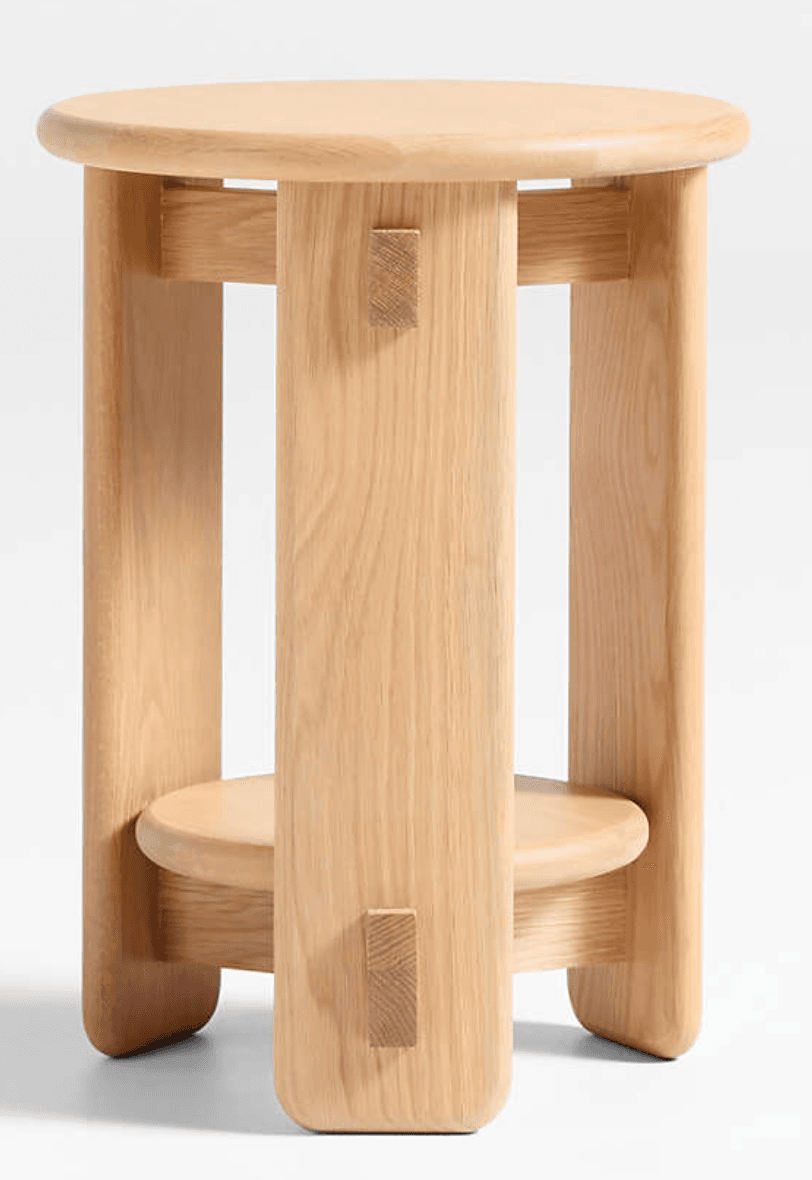 A minimalist natural ash wood stool featuring a round top, a smaller round lower shelf, and distinctive visible pegged joinery, presented against a white background. — 3D model