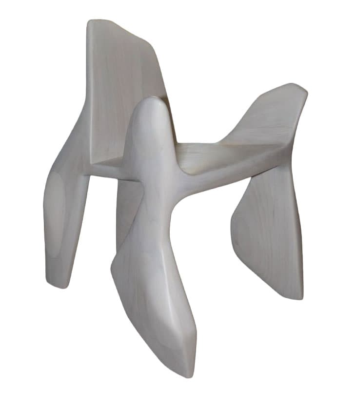 A uniquely sculpted accent chair with organic, flowing lines. The chair features a low-slung seat, an integrated backrest that curves upwards, and armrests that extend from the sides. Its base is composed of four distinct, sculpted legs that create an unusual silhouette. The overall form suggests a modern or contemporary design aesthetic with an emphasis on artistic expression. — 3D model