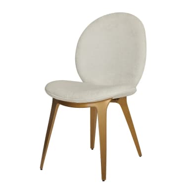 A contemporary accent chair featuring a rounded, upholstered back and seat in cream bouclé fabric, supported by splayed gold-tone metal legs. — 3D model