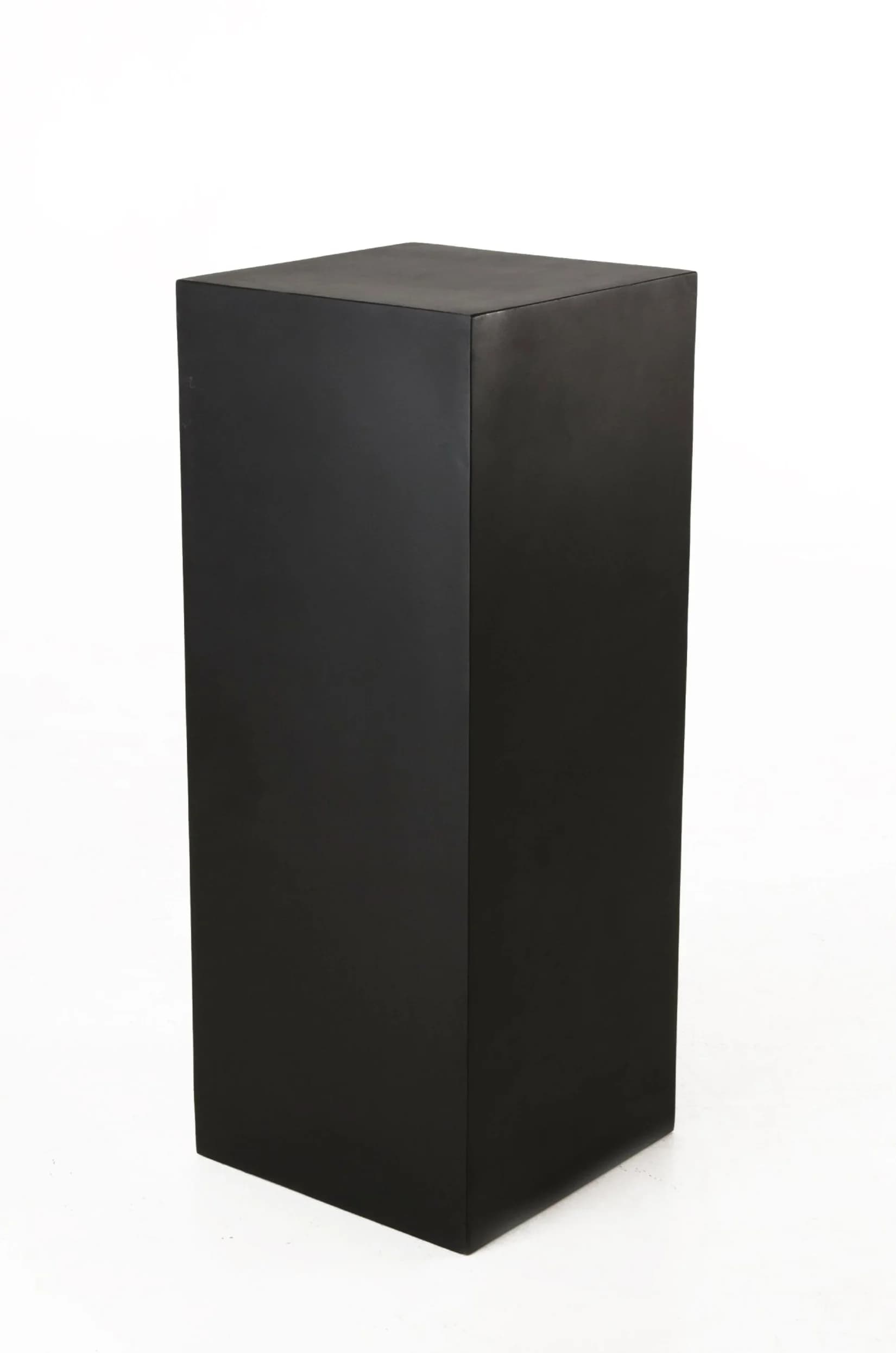 A tall, rectangular display pedestal with a minimalist design, finished in a uniform matte black. Its solid, box-like structure features sharp, clean edges, providing a contemporary and unobtrusive base for showcasing objects. — 3D model