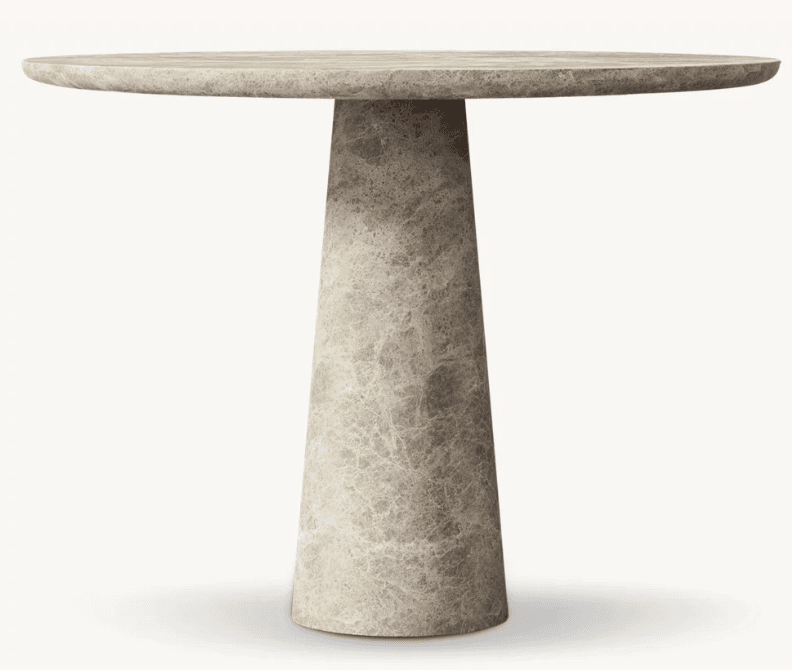 A robust, round table featuring a thick circular tabletop and a sturdy, conical pedestal base, all constructed from light grey marble with distinct natural veining. — 3D model