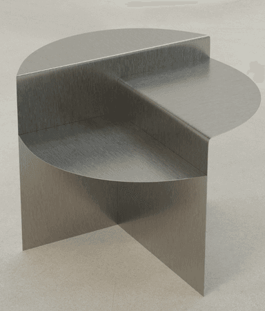A modern end table with a unique geometric design. It features a circular top surface partially overlapping a rectangular body, with a single vertical support. The overall construction appears to be made of metal with a brushed finish. — 3D model