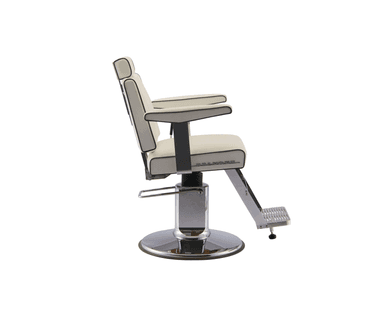 A white barber chair with channel tufting on the seat back and seat. It features chrome accents on the armrests, base, footrest, and hydraulic lift mechanism. The chair includes a headrest and a flip-up footrest. There is a logo on the side of the seat that reads 'BELMONT'. — 3D model