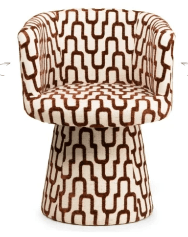 A modern armchair with a rounded, upholstered form. The chair features a high back that curves into armrests, enclosing the seating area. The base is a tapered pedestal, also upholstered, providing stability. The upholstery displays a geometric pattern of interlocking U-shapes in brown on an off-white background. — 3D model