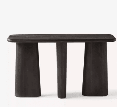 A dark-stained wooden console table featuring a rectangular top with subtly rounded corners. The table stands on three distinct supports: two wider, trapezoidal legs positioned at either end, and a narrower, cylindrical central leg, all tapering slightly towards the top. — 3D model
