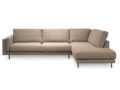 A sectional sofa with a light beige fabric upholstery and slender gold-toned legs. The sofa features a modular design with multiple seating sections, including a chaise lounge extension on the right. The back cushions are slightly curved, and the armrests are squared. The overall aesthetic is modern and minimalist. — 3D model
