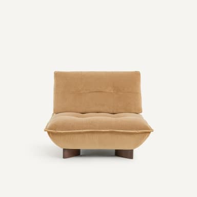 A low-profile, contemporary armless lounge chair featuring generous, plush tan upholstery and a rounded, pillowy form. It sits on small, recessed dark wood block feet. — 3D model
