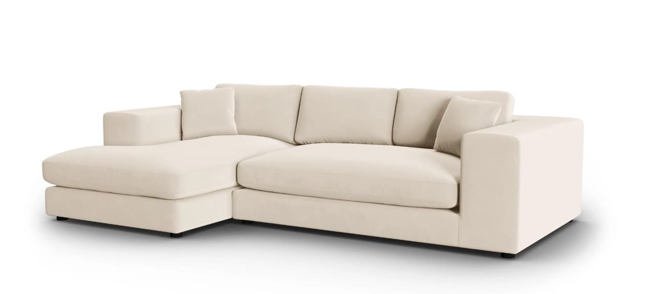 A sectional sofa with a chaise lounge extension. It features a low profile with clean lines and plush cushions. The sofa is upholstered in a light-colored fabric and includes several back cushions and two armrest pillows. — 3D model
