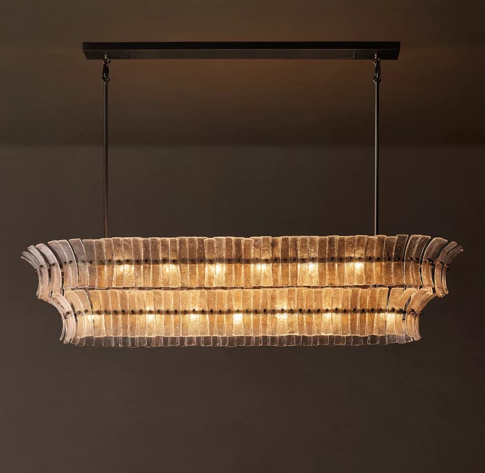 A sophisticated rectangular chandelier featuring multiple layers of textured, clear glass panels suspended within a black metal frame. The panels are arranged horizontally, creating a diffuse, warm glow from the internal light sources. The fixture is suspended by two thin rods from a rectangular black canopy, suggesting a modern or transitional aesthetic. — 3D model