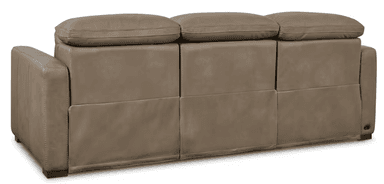 A three-seater sofa with a neutral taupe upholstery, featuring plush, overstuffed cushions on the back and seat. The arms are padded and squared, with visible stitching details along the edges and seams. The base of the sofa is solid and rests on short, dark rectangular feet. — 3D model