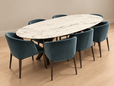 An elegant modern dining table featuring an oval white marble top with prominent grey veining, supported by a splayed dark wood base. The legs are angled outwards from a central point, giving the table a contemporary and stable appearance. The finish of the table appears pristine. — 3D model