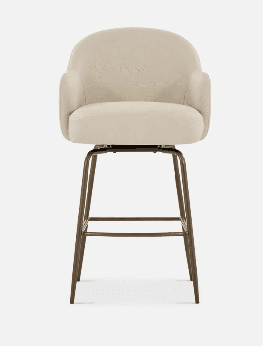 A contemporary upholstered swivel bar stool featuring a cream or beige fabric seat and back with integrated armrests. The seat is well-padded with a rounded profile, and the back flows seamlessly into the armrests. It is supported by a bronze-finished metal four-leg base with a square footrest, indicating a fixed height design. The stool includes a swivel mechanism for ease of movement. — 3D model