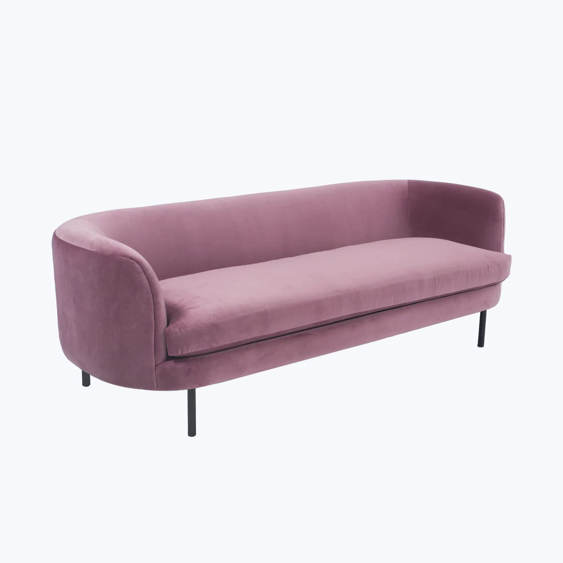 A pink velvet sofa with a curved back and arms, featuring a single seat cushion and a slender black base with four legs. — 3D model