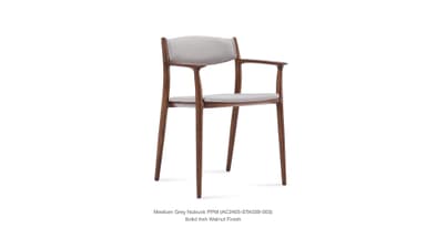 A side profile view of a modern armchair with a wooden frame and upholstered seat and backrest. The frame is constructed from solid ash with a walnut finish. The upholstery appears to be a light grey nubuck fabric. — 3D model