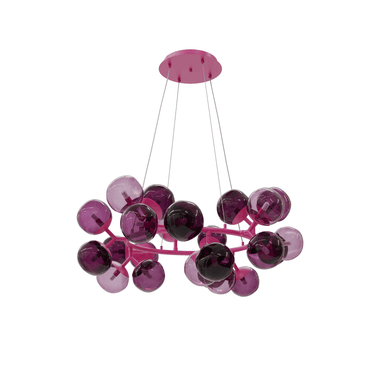 A vibrant modern chandelier featuring a circular pink metal frame from which multiple spherical glass shades are suspended. The shades vary in shades of purple, ranging from lighter translucent lilac to darker, more opaque violet. Each sphere appears to house a small LED bulb. The entire structure is suspended by thin wires from a matching pink ceiling canopy. — 3D model