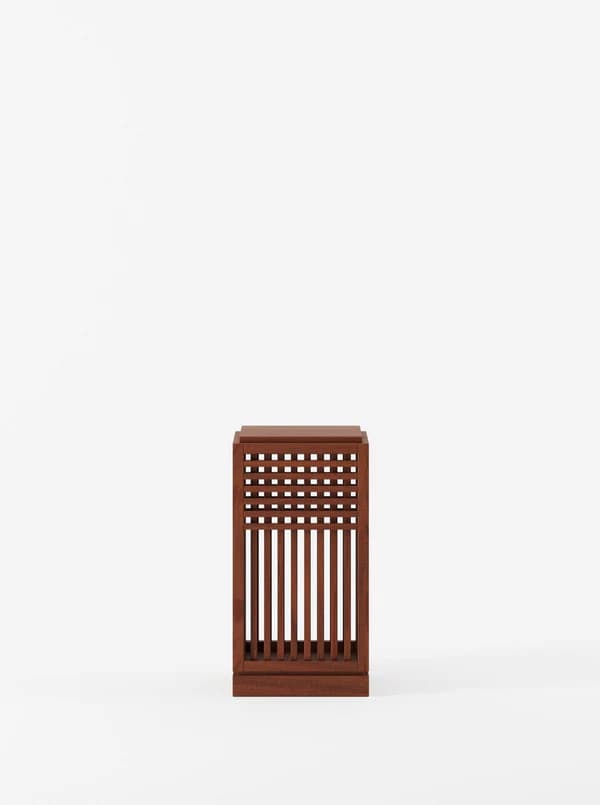 A rectangular wooden end table with a slatted design on its front panel. The slatted design consists of vertical slats and horizontal crossbars creating a grid pattern. The top surface is flat and solid. — 3D model
