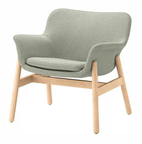 A modern armchair with a gently curved backrest and armrests, upholstered in a light green fabric. The chair features a separate seat cushion and is supported by a light-colored wooden frame consisting of four legs and crossbars. — 3D model