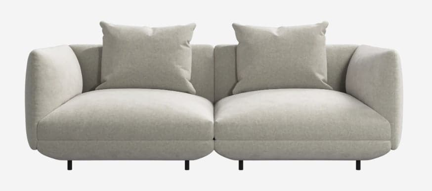 A contemporary two-seater modular sofa upholstered in a light beige fabric, featuring a plush, rounded silhouette, deep seat cushions, and discrete black metal legs. — 3D model