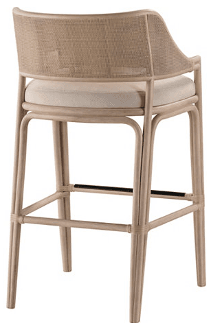 A bar stool with a curved backrest and armrests, featuring a woven cane pattern for the back and sides, and a padded seat cushion. The frame and legs are made of a light-colored material, possibly rattan or bamboo, with a natural finish. The legs are connected by horizontal supports for stability. A thin, dark band is visible across the front and back leg supports. — 3D model