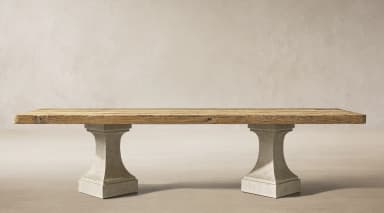 A rectangular dining table featuring a thick, distressed reclaimed wood plank top supported by two sturdy, light gray concrete pedestal bases. — 3D model