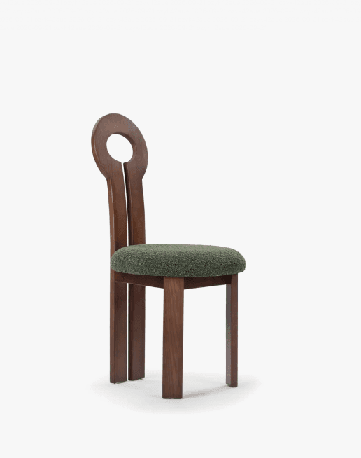 A modernist dining chair featuring a solid wood frame with a dark brown finish and an upholstered seat. The chair's most distinctive feature is its tall backrest, which has a vertical split and culminates in a circular cutout at the top. The seat is padded and covered in a textured, dark green bouclé fabric. The legs are straight and rectangular. — 3D model