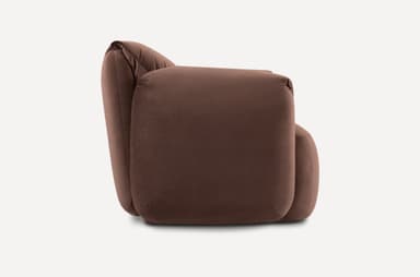 A contemporary armchair with plush upholstery and generous cushioning. The armchair features rounded edges and deep, inviting seat and backrest areas, complemented by loose back cushions that add to its comfortable and relaxed aesthetic. It is presented against a neutral background. — 3D model
