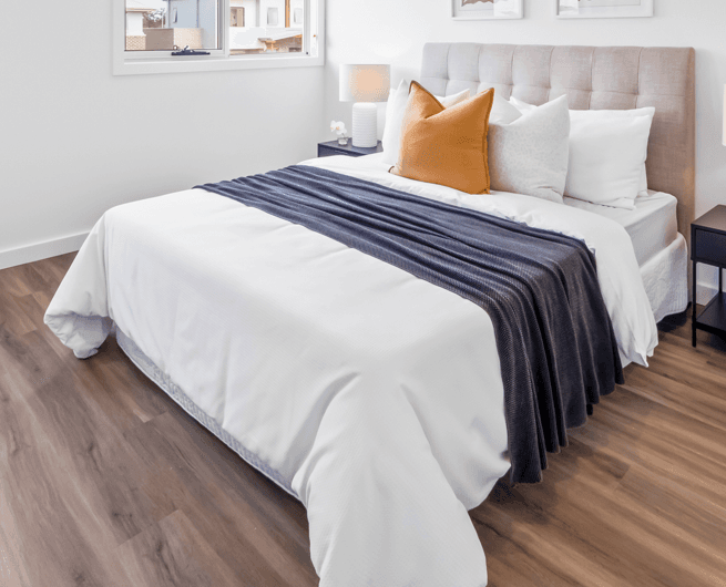 A modern upholstered platform bed featuring a channel-tufted headboard, presented with neutral-toned fabric. — 3D model