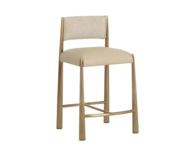 A contemporary bar stool with a metal frame and upholstered seat and backrest. The frame has a warm metallic finish and features tapered legs connected by a footrest. The seat and backrest are padded and covered in a neutral-toned fabric. — 3D model