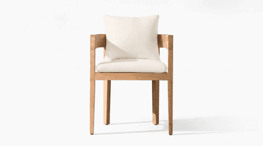 A modern armchair featuring a rectilinear wooden frame constructed from a light-toned hardwood, possibly teak. The chair includes a thick seat cushion and a back cushion, both upholstered in an off-white or cream-colored fabric. The frame has prominent, flat armrests and straight legs, emphasizing a clean, minimalist aesthetic. — 3D model