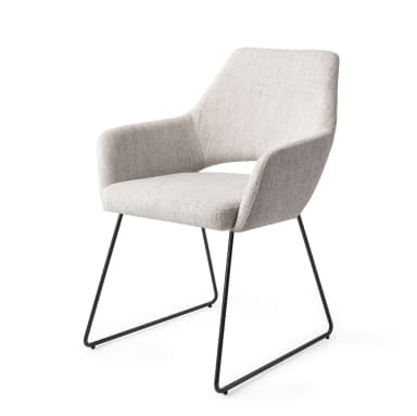 A contemporary armchair featuring a fully upholstered bucket-style seat and backrest in a light gray woven fabric. The chair is supported by a minimalist base of slender, black powder-coated metal legs, arranged in a distinctive inverted 'U' shape. — 3D model
