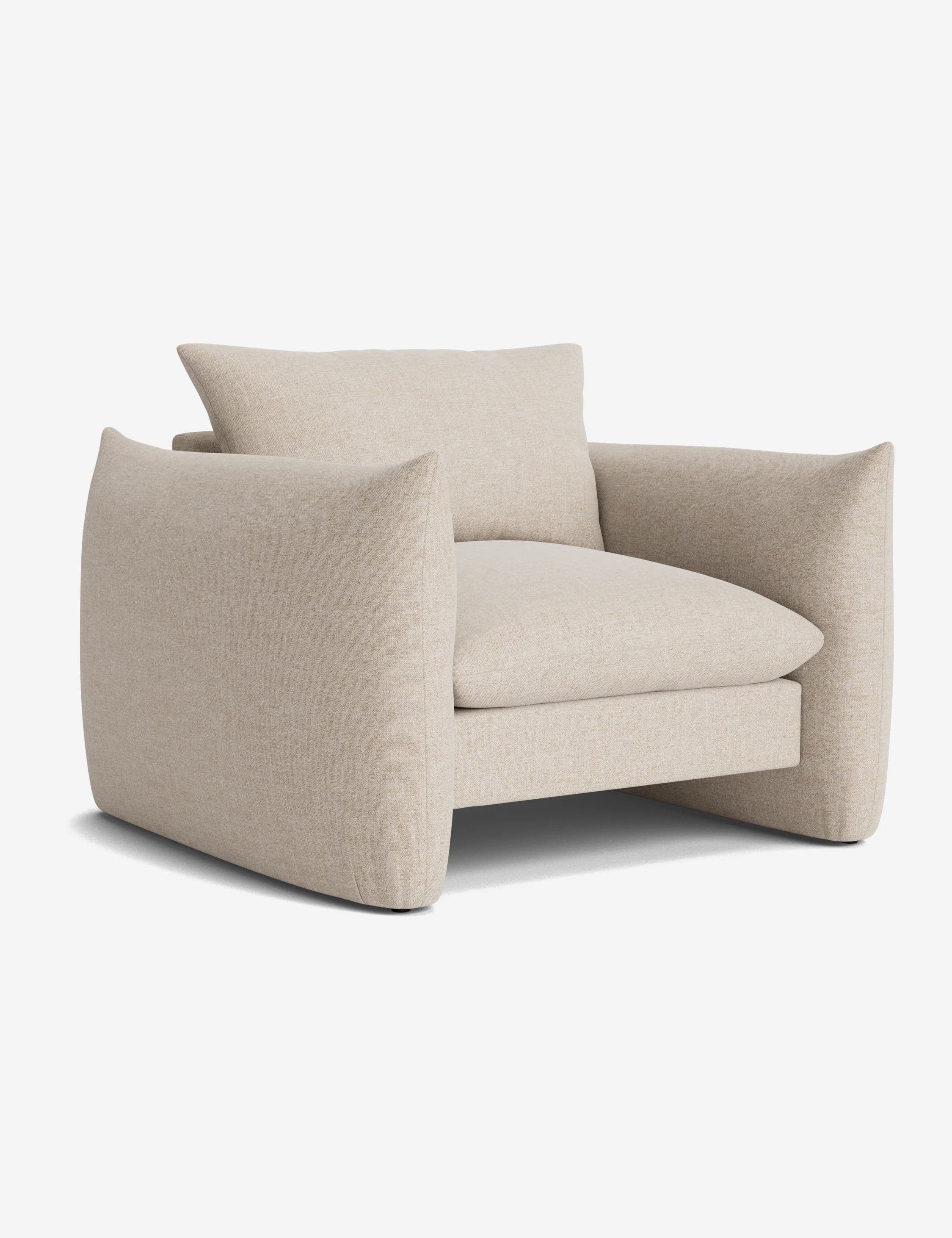 A modern upholstered armchair featuring a clean, boxy silhouette with generous proportions. It is covered in a light beige, subtly textured woven fabric and includes a loose seat cushion and a loose back cushion, both matching the main upholstery. The armrests are wide and integrated into the frame, extending down to form the base, which has a slightly recessed appearance. — 3D model