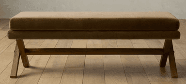 A rectangular bench featuring a thick, upholstered cushion in a beige/tan color supported by a dark wood X-frame base. — 3D model