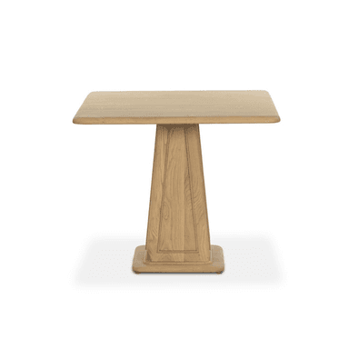 A square-top pedestal dining table crafted from wood. The table features a thick, slightly rounded square top supported by a substantial, tapered pedestal base. The pedestal has vertical paneling details and sits on a wide, flat base. — 3D model