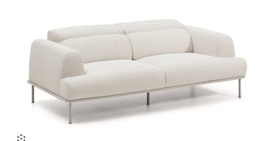 A light-colored, two-seater sofa with a textured fabric upholstery, plush rounded armrests, and segmented back cushions, supported by a sleek metal frame with slender legs. — 3D model
