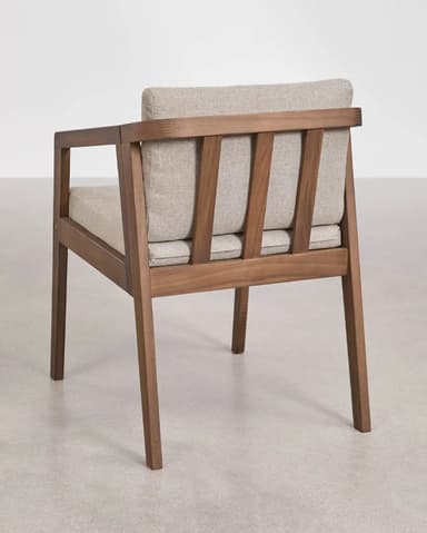 A modern armchair with a wooden frame and upholstered cushions for the seat and back. The frame has a minimalist design with straight lines and visible joinery. The upholstery is a textured fabric in a neutral tone. — 3D model